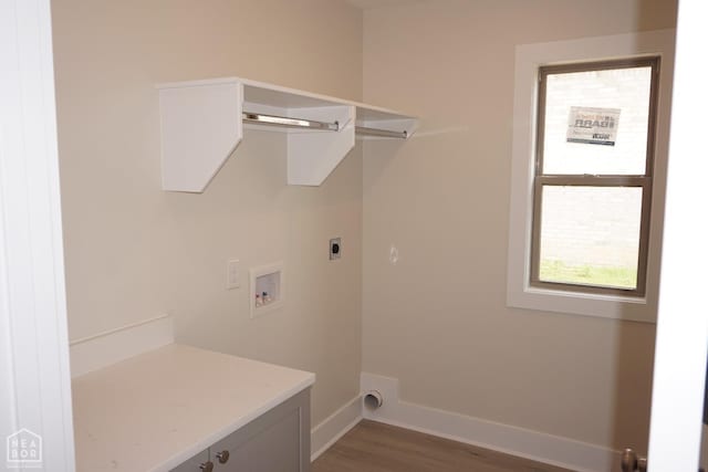 laundry area featuring laundry area, wood finished floors, baseboards, hookup for a washing machine, and hookup for an electric dryer