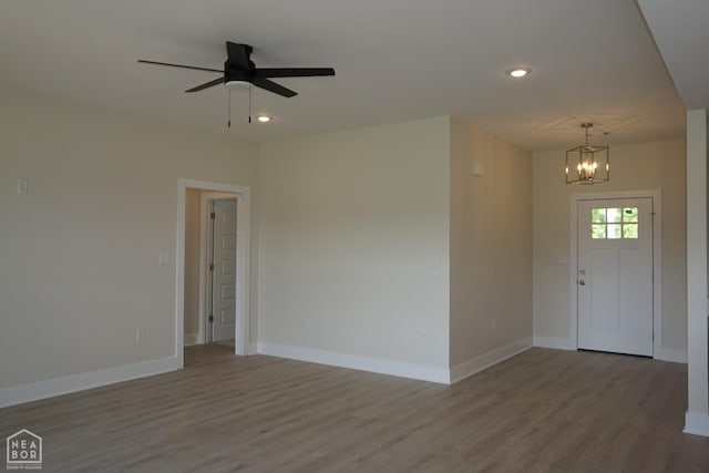 foyer entrance featuring baseboards, recessed lighting, and wood finished floors