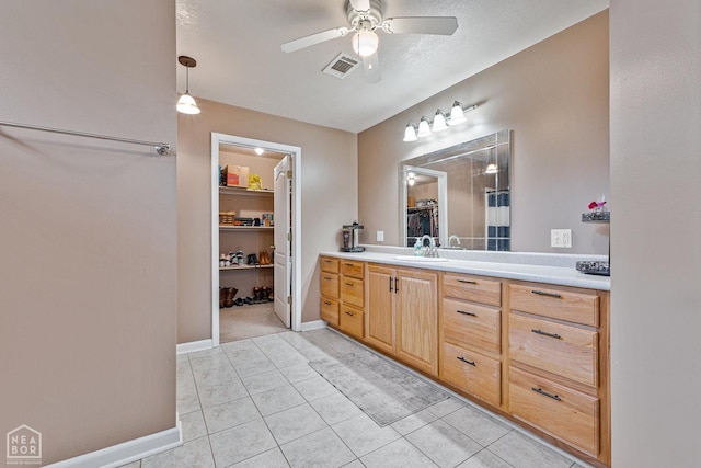 616 Greene 326 Rd, Jonesboro, AR 72401 - full bathroom with vanity, a ceiling fan, visible vents, a walk in closet, and baseboards