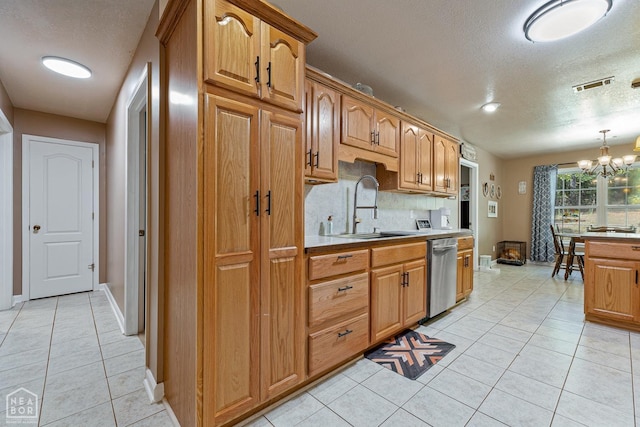 616 Greene 326 Rd, Jonesboro, AR 72401 - kitchen with stainless steel dishwasher, visible vents, light tile patterned flooring, a sink, and a notable chandelier
