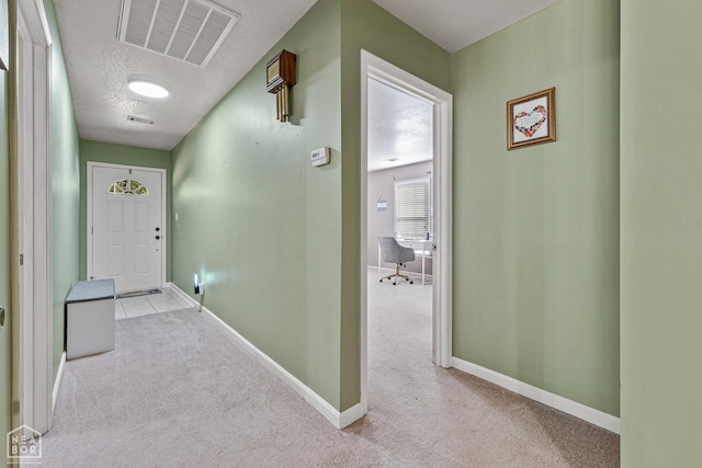 616 Greene 326 Rd, Jonesboro, AR 72401 - corridor featuring a textured ceiling, carpet flooring, baseboards, and visible vents