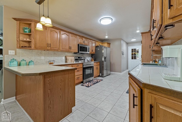 616 Greene 326 Rd, Jonesboro, AR 72401 - kitchen featuring backsplash, light tile patterned floors, a peninsula, and stainless steel appliances