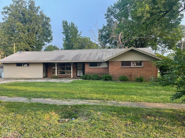 1305 Rosemond Ave, Jonesboro, AR 72401 - ranch-style home featuring a front lawn, metal roof, brick siding, and covered porch