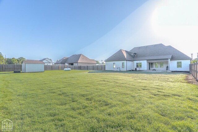 4049 Hwy 351, Jonesboro, AR 72405 - view of yard with a fenced backyard, a patio area, an outdoor structure, and a shed