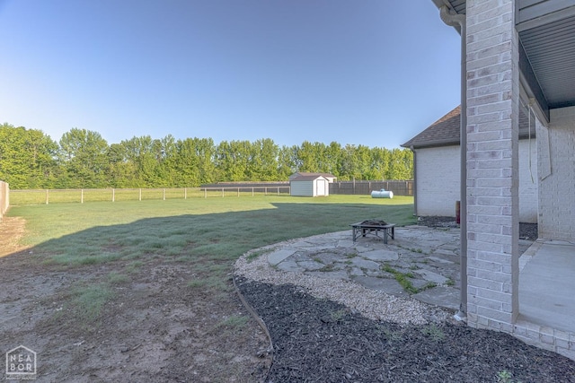 4049 Hwy 351, Jonesboro, AR 72405 - view of yard with a storage shed, a patio area, an outdoor structure, a fenced backyard, and an outdoor fire pit