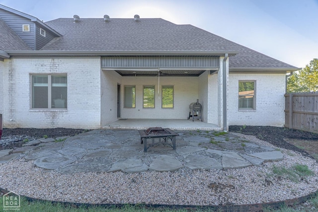 4049 Hwy 351, Jonesboro, AR 72405 - rear view of property featuring brick siding, roof with shingles, fence, and a patio