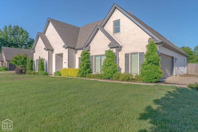 4049 Hwy 351, Jonesboro, AR 72405 - view of front of home featuring brick siding, an attached garage, concrete driveway, a front yard, and roof with shingles