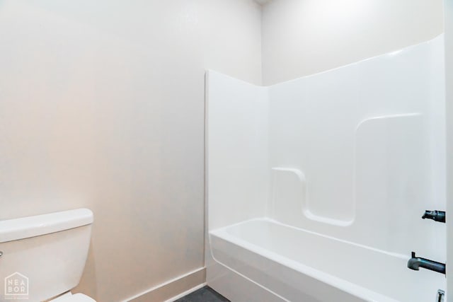 4049 Hwy 351, Jonesboro, AR 72405 - bathroom with toilet, baseboards, and washtub / shower combination