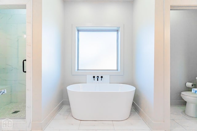 4049 Hwy 351, Jonesboro, AR 72405 - bathroom with a stall shower, baseboards, a soaking tub, and toilet