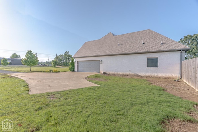 4049 Hwy 351, Jonesboro, AR 72405 - view of home's exterior featuring fence, an attached garage, brick siding, concrete driveway, and a lawn