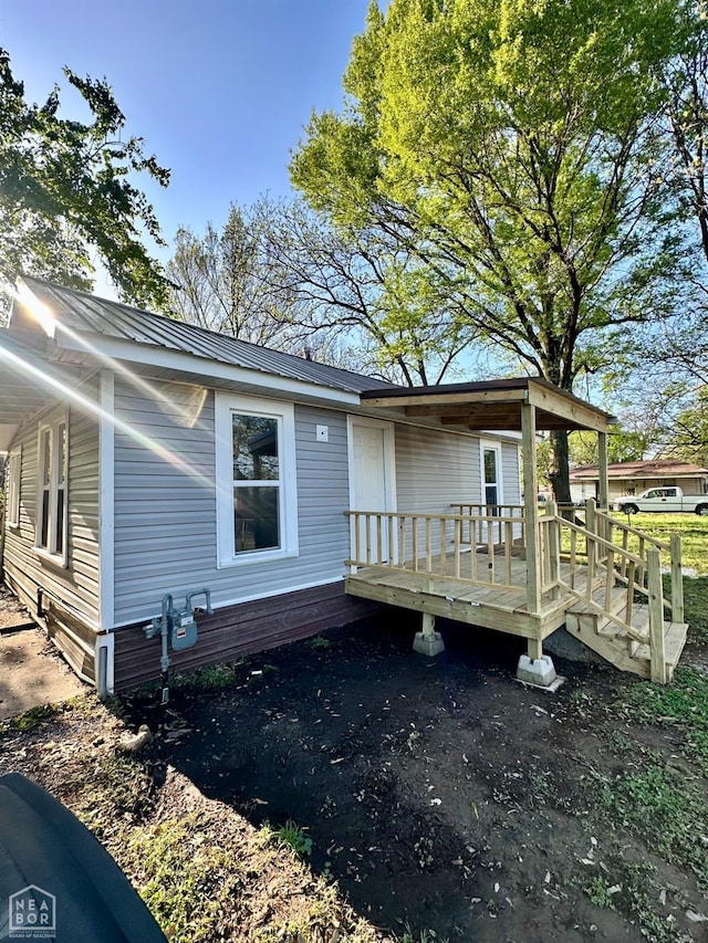 513 Lewis Ave, Trumann, AR 72472 - exterior space featuring metal roof and a wooden deck