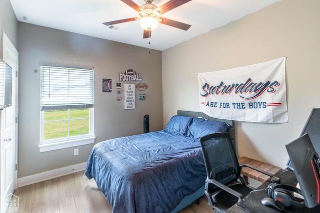 3620 Leafy Pass, Jonesboro, AR 72404 - bedroom with wood finished floors, ceiling fan, and baseboards