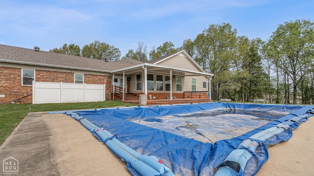 view of pool with a fenced in pool and fence