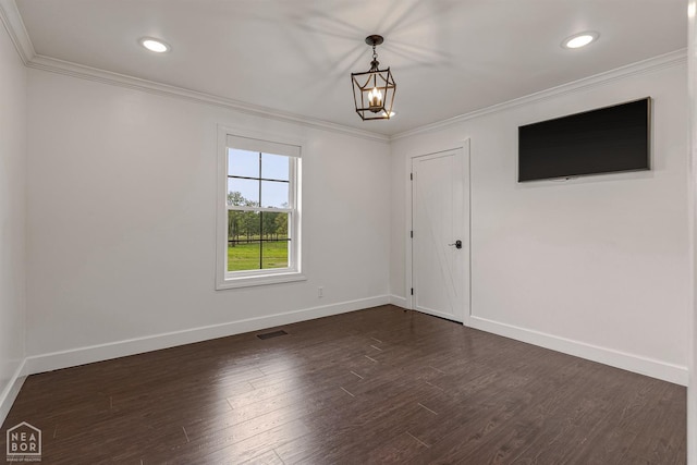 spare room with ornamental molding, visible vents, recessed lighting, dark wood-style flooring, and baseboards