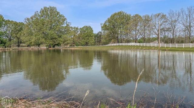 view of water feature featuring fence
