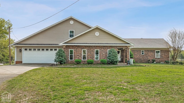 view of front of property with concrete driveway, roof with shingles, a front yard, brick siding, and a garage