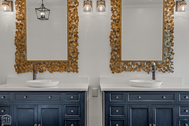 bathroom with vanity and ornamental molding