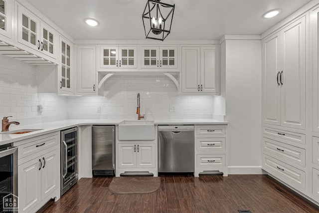 kitchen featuring wine cooler, dishwasher, and a sink