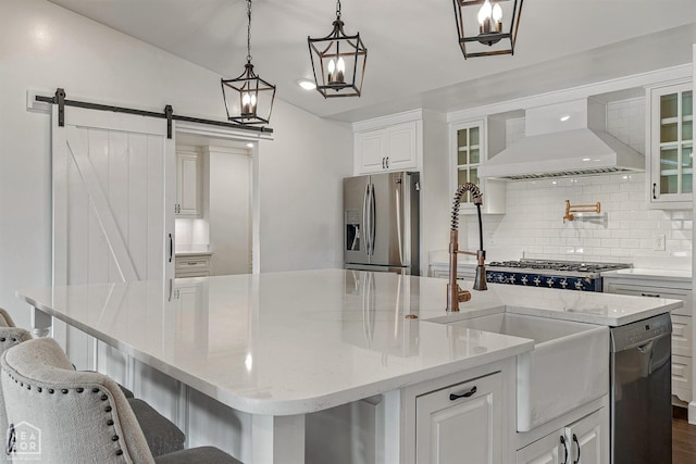 kitchen featuring stainless steel refrigerator with ice dispenser, dishwashing machine, a large island with sink, custom range hood, and backsplash