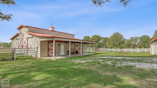 rear view of house with an outbuilding and an exterior structure