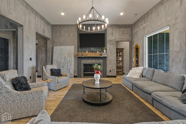 472 County Road 149, Jonesboro, AR 72404 - living area featuring visible vents, an inviting chandelier, light wood-type flooring, a fireplace, and recessed lighting