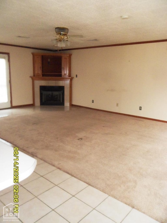 805 Cherokee Dr, Newport, AR 72112 - unfurnished living room featuring light colored carpet, a fireplace, ceiling fan, and crown molding