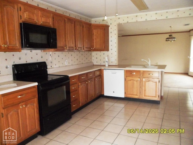 805 Cherokee Dr, Newport, AR 72112 - kitchen with black appliances, a peninsula, light countertops, backsplash, and ornamental molding