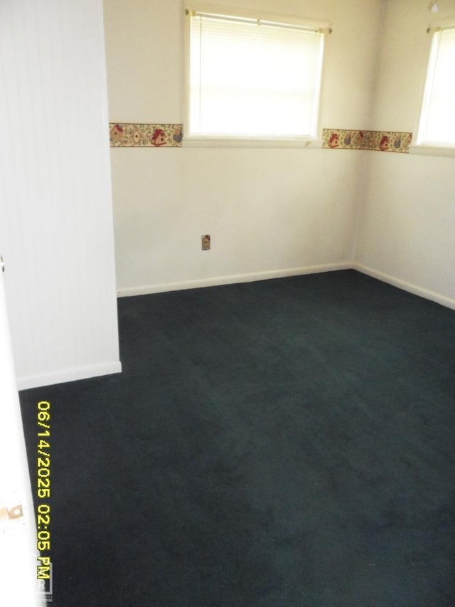 805 Cherokee Dr, Newport, AR 72112 - empty room featuring dark carpet