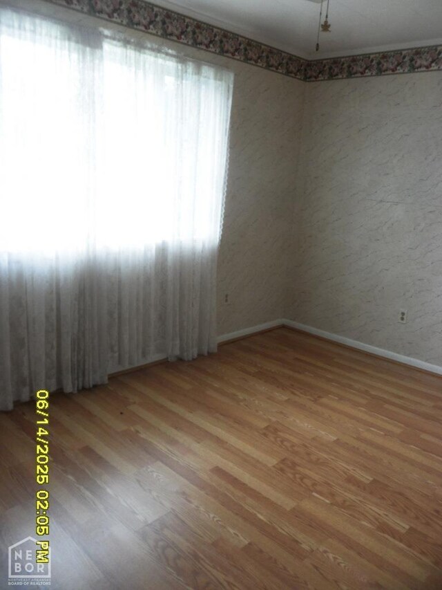805 Cherokee Dr, Newport, AR 72112 - empty room featuring baseboards and wood finished floors