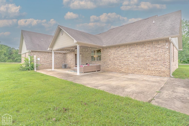 2 Deer Run, Clarksville, AR 72830 - back of house featuring a patio, brick siding, a lawn, and ceiling fan