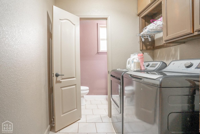 2 Deer Run, Clarksville, AR 72830 - laundry area with independent washer and dryer, cabinet space, a textured wall, and light tile patterned flooring