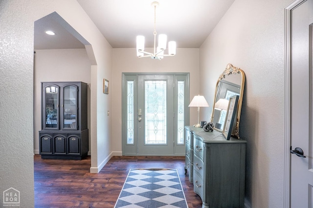 2 Deer Run, Clarksville, AR 72830 - foyer with dark wood finished floors, a chandelier, and arched walkways