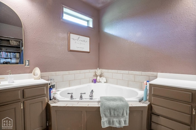 2 Deer Run, Clarksville, AR 72830 - full bath with vanity, a garden tub, and a textured wall