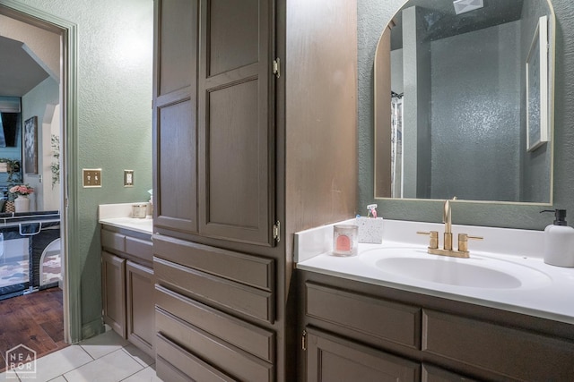 2 Deer Run, Clarksville, AR 72830 - bathroom with vanity, a textured wall, and tile patterned floors