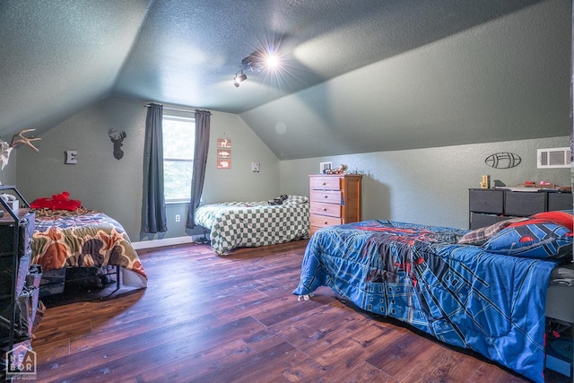 2 Deer Run, Clarksville, AR 72830 - bedroom featuring wood finished floors, a textured ceiling, lofted ceiling, and a textured wall