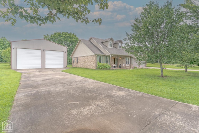 2 Deer Run, Clarksville, AR 72830 - cape cod-style house with brick siding, an outbuilding, a front yard, a garage, and a porch