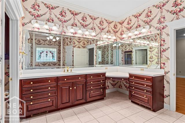 3201 S 2nd Ave S, Paragould, AR 72450 - full bathroom featuring ornamental molding, vanity, wallpapered walls, and tile patterned flooring