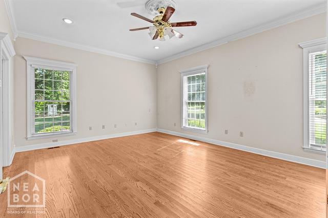 3201 S 2nd Ave S, Paragould, AR 72450 - spare room with ceiling fan, light wood-style floors, ornamental molding, and recessed lighting