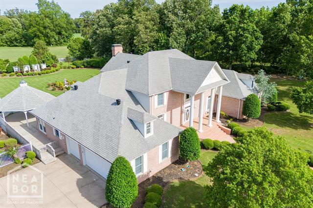3201 S 2nd Ave S, Paragould, AR 72450 - view of subject property with a tree filled landscape
