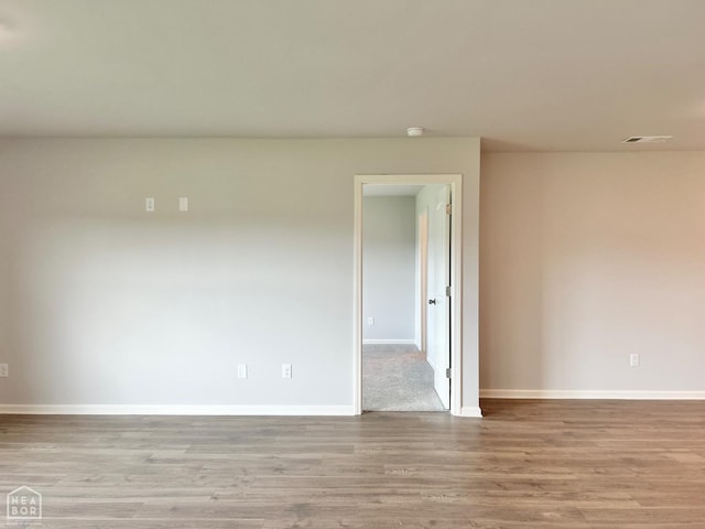 119 Terry Dr, Brookland, AR 72417 - spare room with wood finished floors and a smoke detector