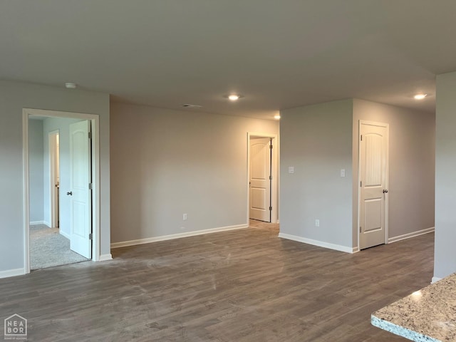 119 Terry Dr, Brookland, AR 72417 - empty room with baseboards, dark wood finished floors, recessed lighting, and a smoke detector