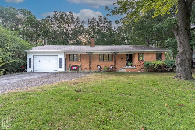 ranch-style home featuring an attached garage, a chimney, a front lawn, a porch, and driveway