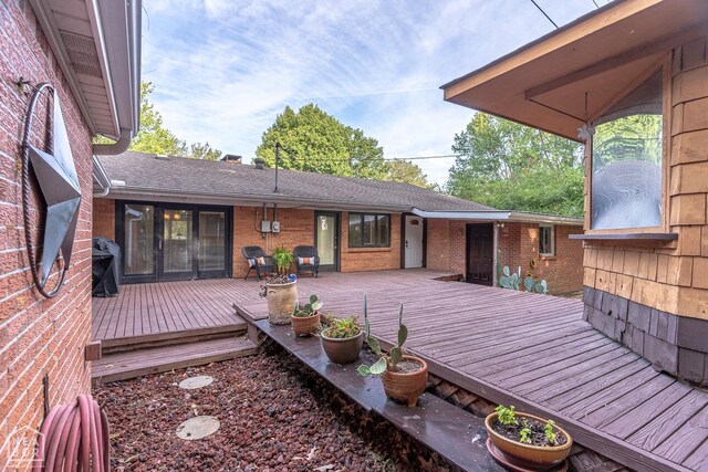 wooden deck featuring grilling area