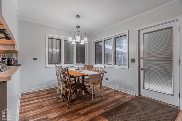 dining space with a chandelier, crown molding, baseboards, and dark wood-style floors