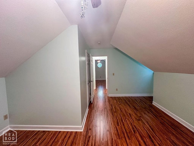 3013 Park Hill Blvd, Jonesboro, AR 72404 - additional living space with a textured ceiling, wood finished floors, lofted ceiling, and baseboards
