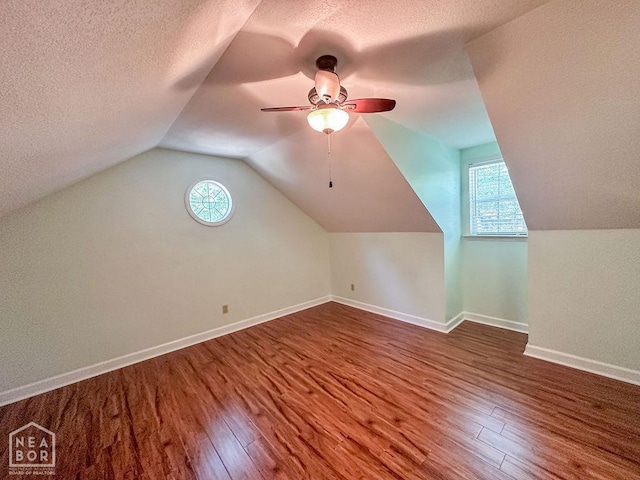 3013 Park Hill Blvd, Jonesboro, AR 72404 - bonus room featuring wood finished floors, a textured ceiling, lofted ceiling, ceiling fan, and baseboards