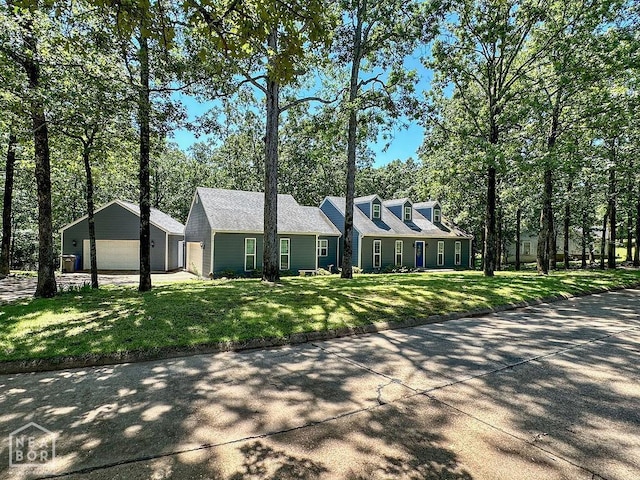 3013 Park Hill Blvd, Jonesboro, AR 72404 - cape cod home with a front yard, an outdoor structure, and a garage