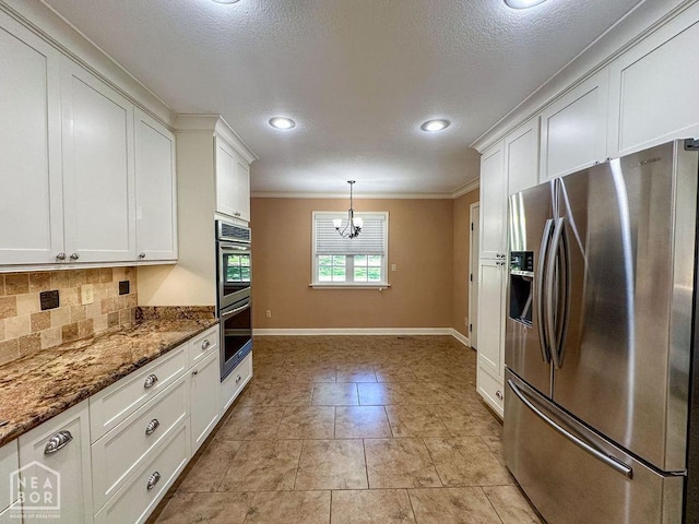 3013 Park Hill Blvd, Jonesboro, AR 72404 - kitchen with appliances with stainless steel finishes, backsplash, ornamental molding, white cabinetry, and a chandelier