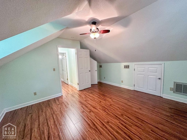 3013 Park Hill Blvd, Jonesboro, AR 72404 - bonus room featuring ceiling fan, wood finished floors, baseboards, lofted ceiling, and a textured ceiling