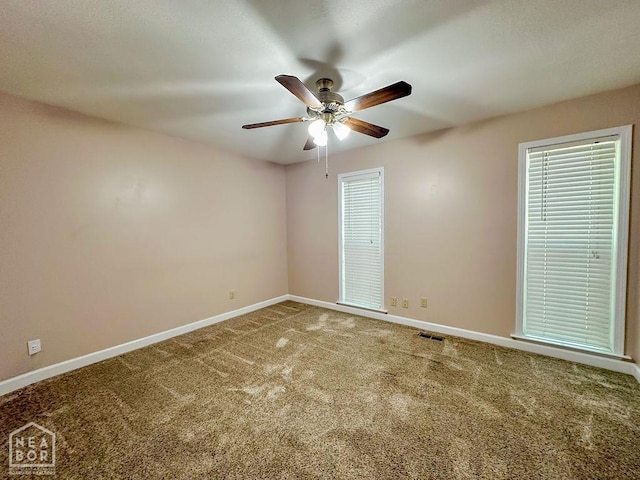 3013 Park Hill Blvd, Jonesboro, AR 72404 - spare room featuring ceiling fan, baseboards, and carpet flooring